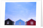 Beach huts in a row against sky by Assaf Frank